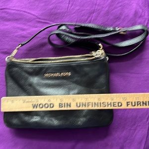 Michael Kors tri-zippered crossbody purse.
